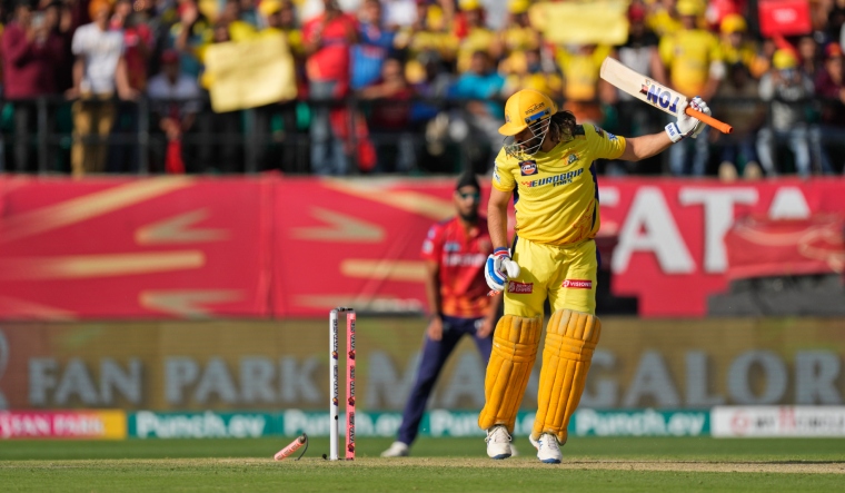 Chennai Super Kings' MS Dhoni is bowled out by Punjab Kings' Harshal Patel | AP